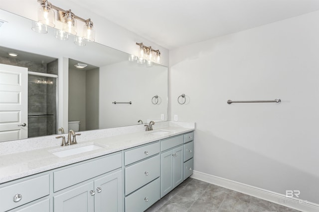 5885 Grotto Ave, Pensacola, FL 32507 - full bath featuring toilet, double vanity, baseboards, and a stall shower