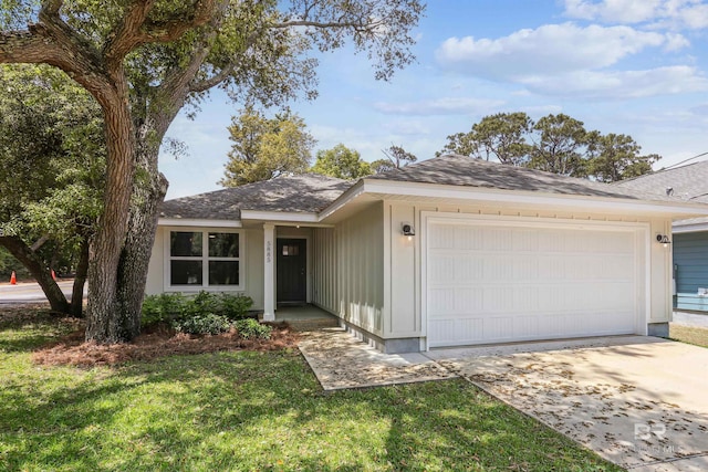 5885 Grotto Ave, Pensacola, FL 32507 - single story home with a garage, driveway, a front yard, and a shingled roof