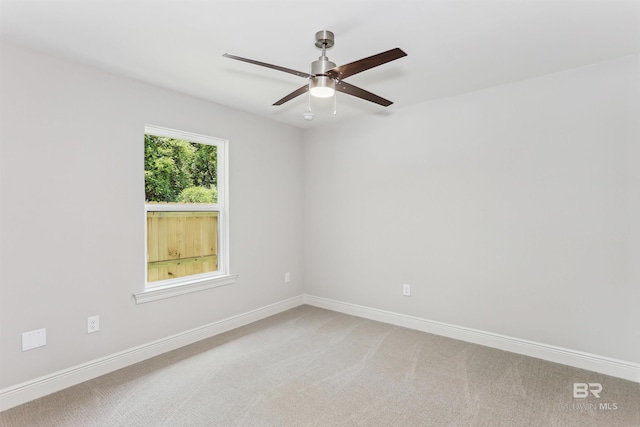 5885 Grotto Ave, Pensacola, FL 32507 - spare room with ceiling fan, light carpet, and baseboards