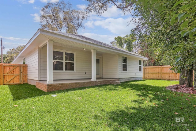 5885 Grotto Ave, Pensacola, FL 32507 - rear view of property with a gate and a patio area