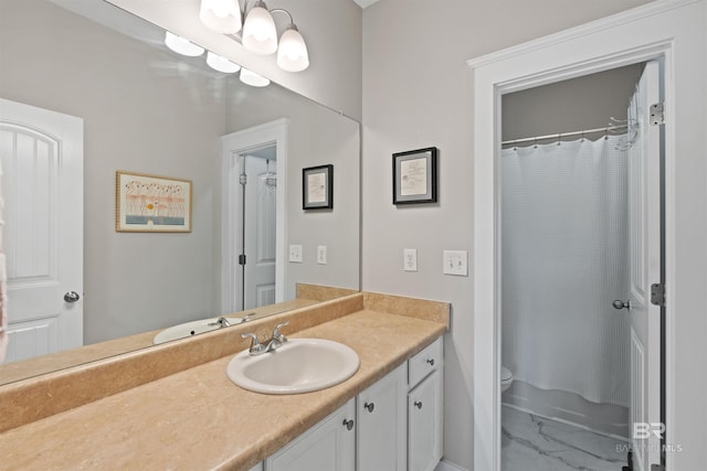 bathroom with toilet and vanity