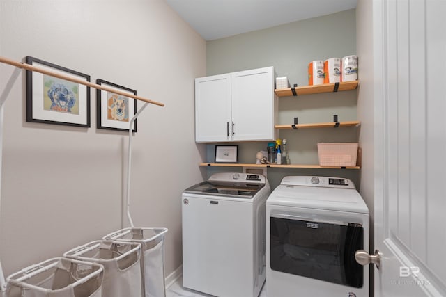 laundry room featuring washer and dryer and cabinet space