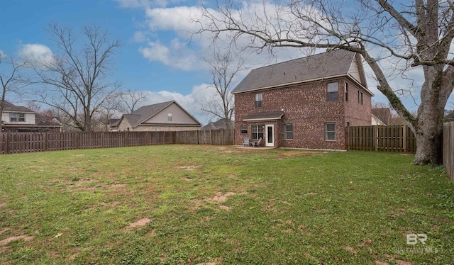 view of yard featuring a patio and a fenced backyard