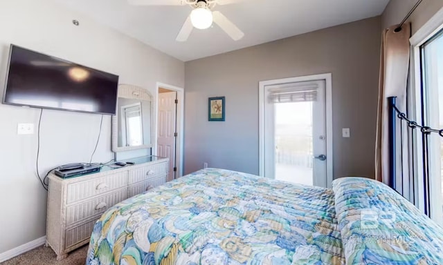 bedroom with a ceiling fan, carpet flooring, and baseboards