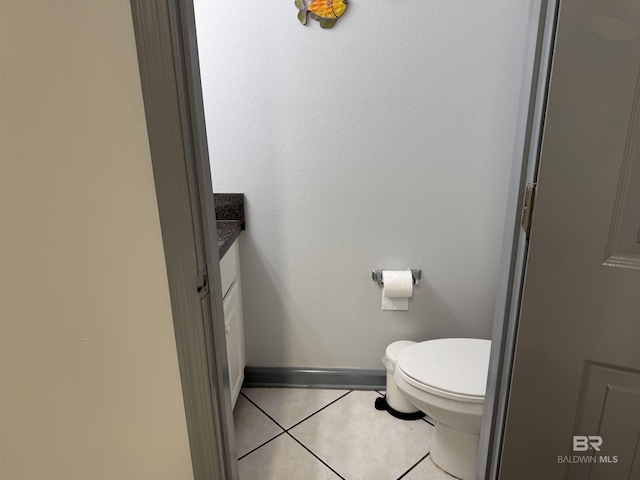 25805 Perdido Beach Blvd Unit 419, Orange Beach, AL 36561 - bathroom with toilet, tile patterned flooring, baseboards, and vanity