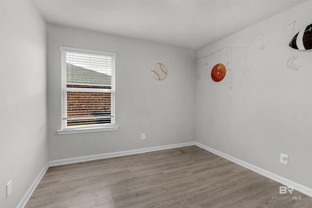 unfurnished room with a healthy amount of sunlight and light wood-type flooring