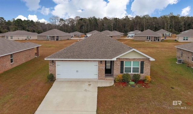 ranch-style house with a garage, a front yard, and central AC