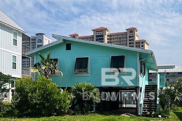 331 E 2nd Ave, Gulf Shores, AL 36542 - view of property featuring stairs