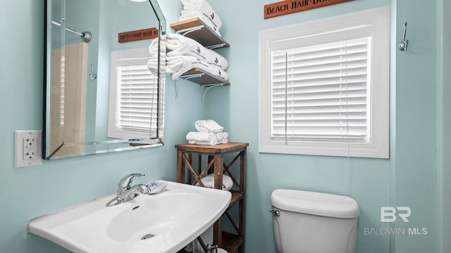 331 E 2nd Ave, Gulf Shores, AL 36542 - bathroom with a sink, toilet, and plenty of natural light
