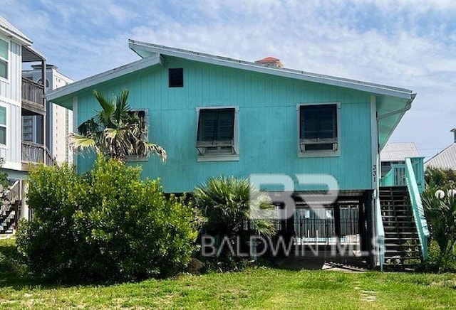 331 E 2nd Ave, Gulf Shores, AL 36542 - rear view of property with stairs