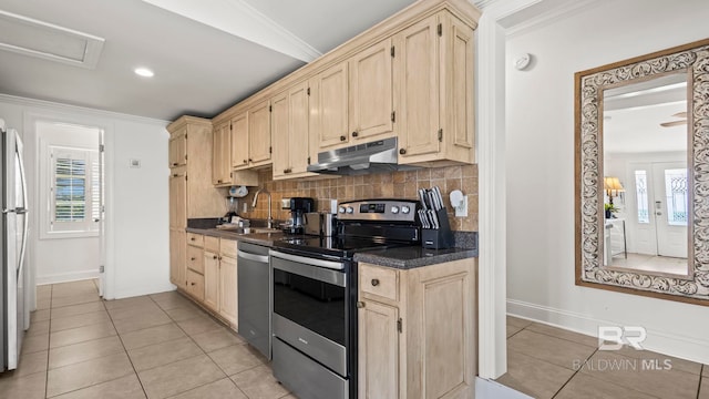 331 E 2nd Ave, Gulf Shores, AL 36542 - kitchen featuring stainless steel appliances, under cabinet range hood, a sink, light brown cabinetry, and dark countertops