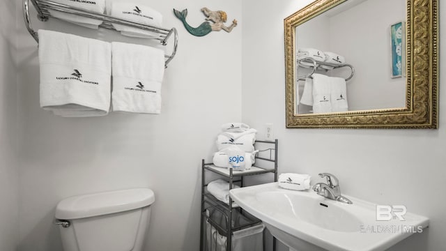 331 E 2nd Ave, Gulf Shores, AL 36542 - bathroom with toilet and a sink