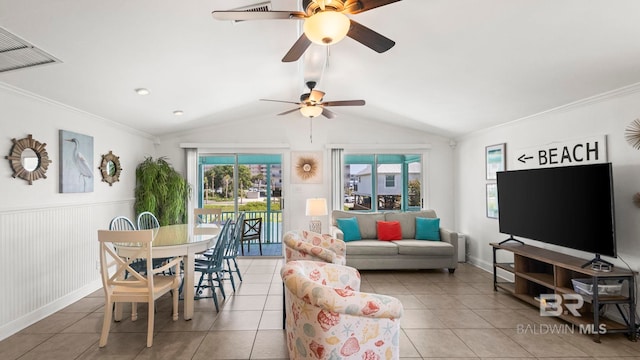 331 E 2nd Ave, Gulf Shores, AL 36542 - tiled living area featuring plenty of natural light, a ceiling fan, a wainscoted wall, and vaulted ceiling