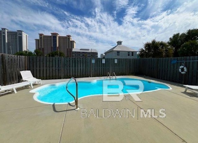 331 E 2nd Ave, Gulf Shores, AL 36542 - view of swimming pool featuring a patio