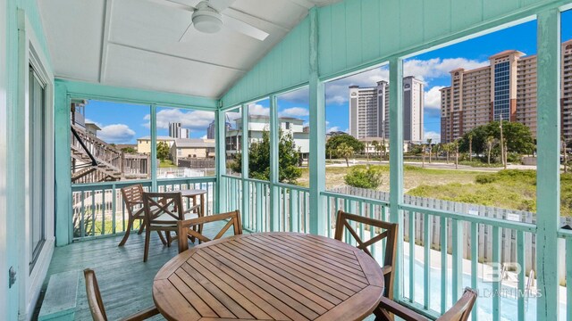 331 E 2nd Ave, Gulf Shores, AL 36542 - sunroom / solarium featuring ceiling fan, lofted ceiling, a view of city, and outdoor dining space
