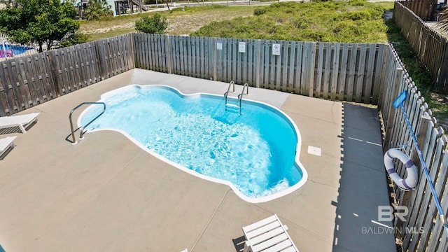331 E 2nd Ave, Gulf Shores, AL 36542 - view of pool featuring a fenced backyard and a patio area