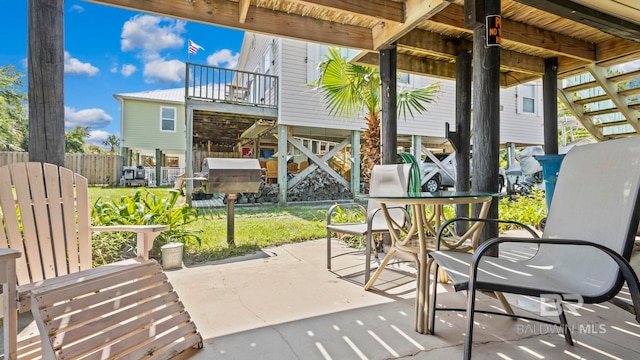 331 E 2nd Ave, Gulf Shores, AL 36542 - view of patio featuring outdoor dining space and stairs