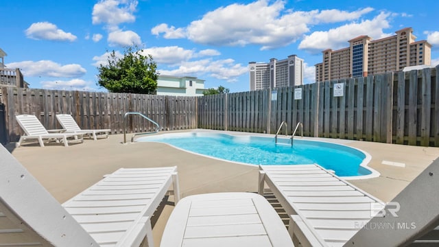 331 E 2nd Ave, Gulf Shores, AL 36542 - view of pool with a patio area and a fenced backyard