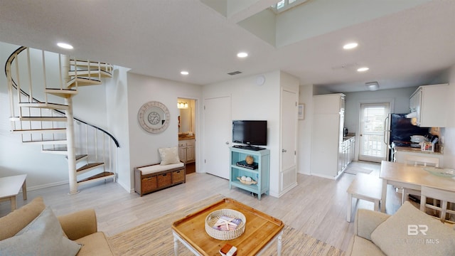 living room with light hardwood / wood-style flooring