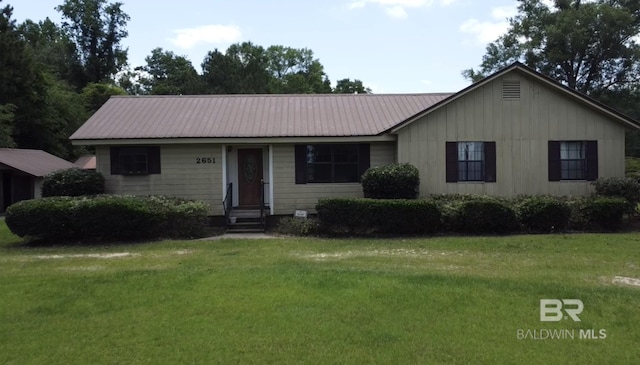 2651 Jay Rd, Brewton, AL 36426 - ranch-style home featuring entry steps, a front yard, and metal roof