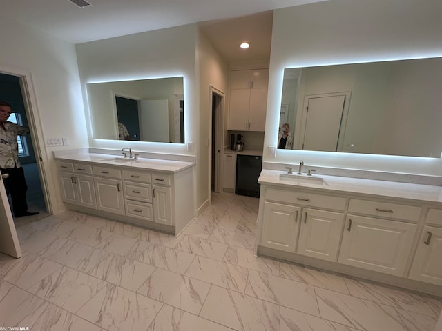 bathroom featuring vanity and tile floors