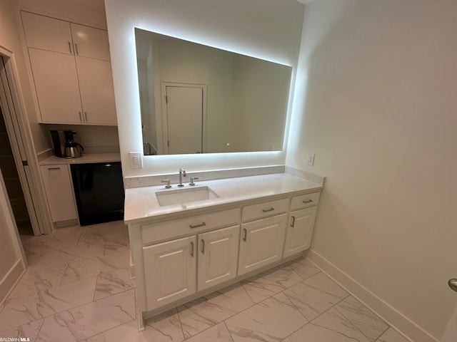 bathroom featuring large vanity and tile flooring