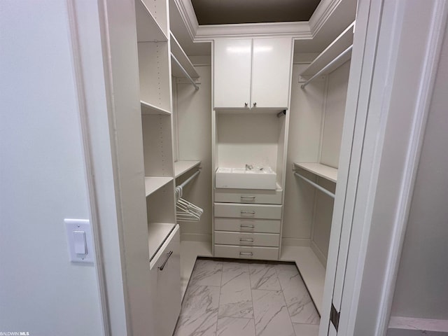 spacious closet featuring light tile flooring