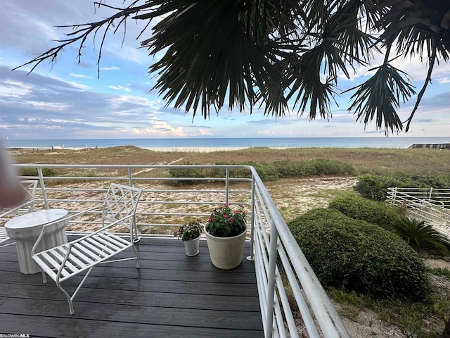 wooden deck with a water view