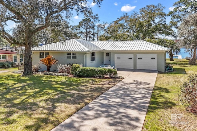 ranch-style house with brick siding, concrete driveway, an attached garage, a front yard, and metal roof