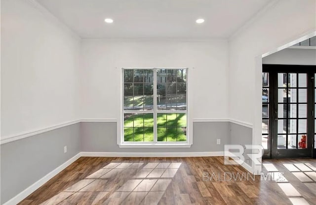 spare room with wood-type flooring