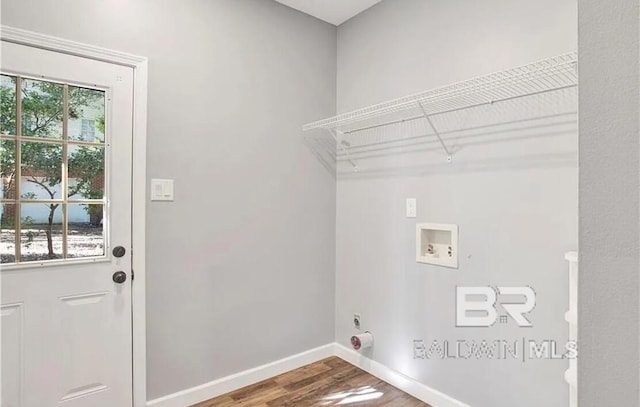 washroom featuring washer hookup, hookup for an electric dryer, and hardwood / wood-style floors