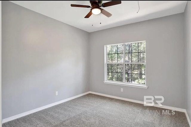 carpeted empty room featuring ceiling fan