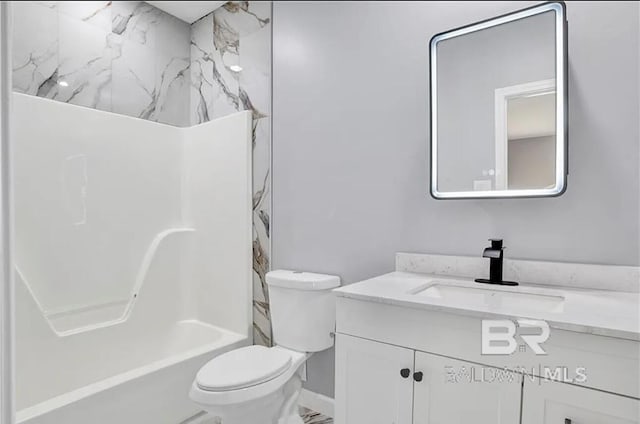 full bathroom with vanity, washtub / shower combination, and toilet