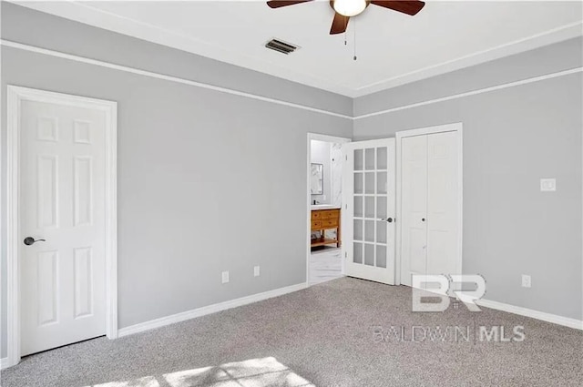 empty room with carpet flooring and ceiling fan