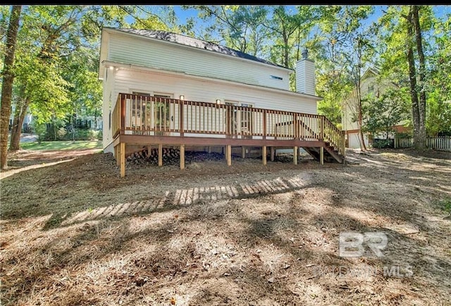 back of house featuring a wooden deck