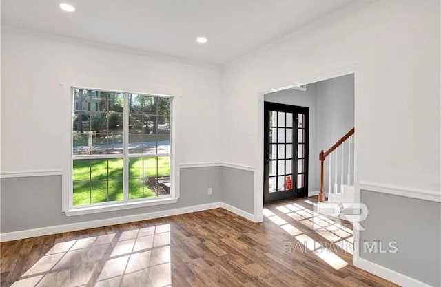 unfurnished room with wood-type flooring