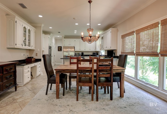 dining area with an inviting chandelier, crown molding, and light tile patterned floors