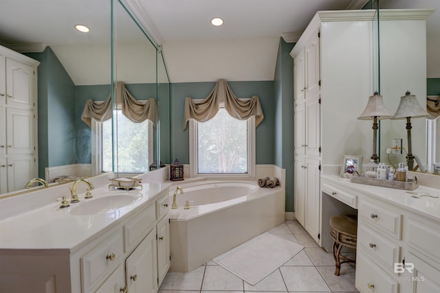 bathroom featuring tile patterned flooring, a bathing tub, and vanity