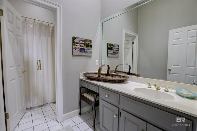 bathroom with tile patterned flooring and vanity