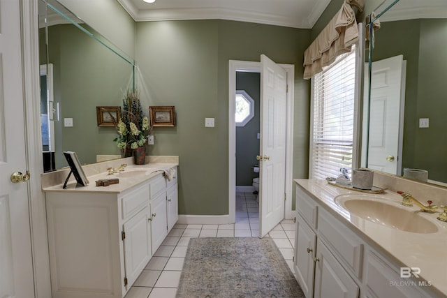 bathroom featuring vanity, toilet, tile patterned flooring, and a healthy amount of sunlight