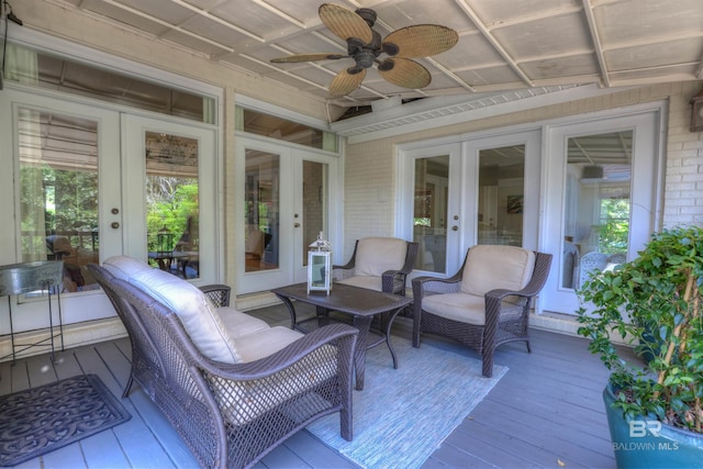 deck featuring ceiling fan and french doors