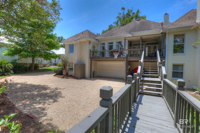 back of property with a garage