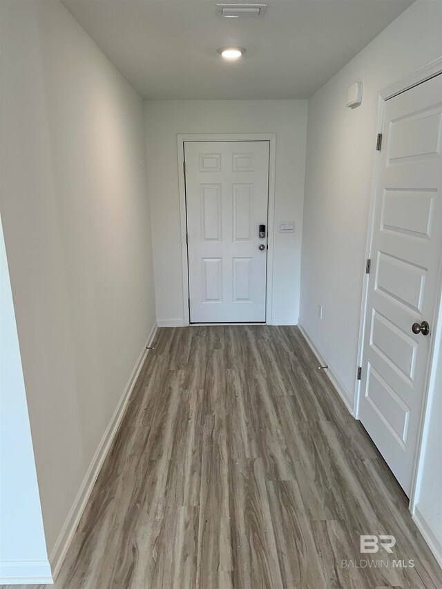 doorway to outside with light hardwood / wood-style floors