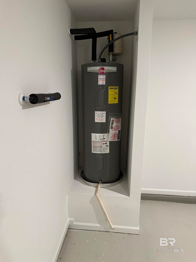 utility room featuring electric water heater