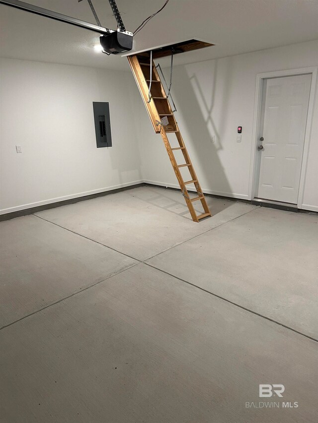 garage featuring electric panel and a garage door opener