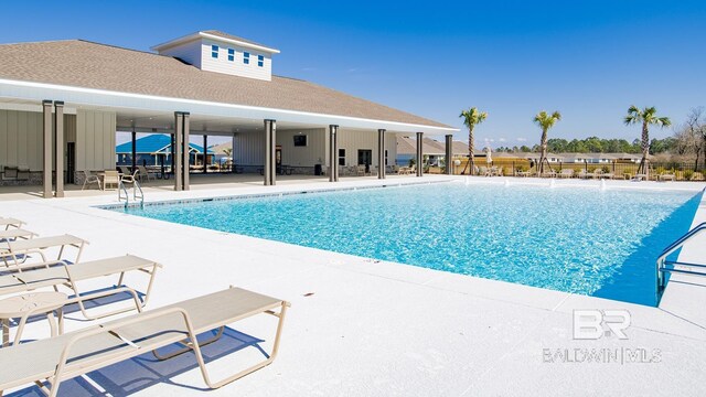 view of swimming pool featuring a patio area