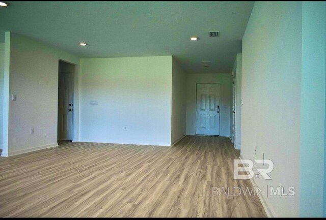 empty room with light hardwood / wood-style floors