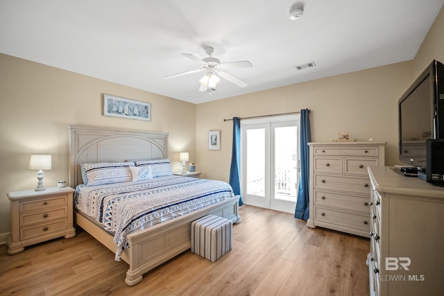 bedroom featuring visible vents, light wood-style floors, access to exterior, and a ceiling fan