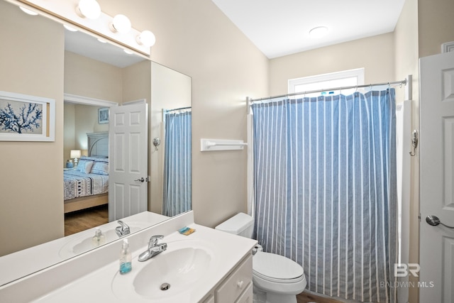 ensuite bathroom with vanity, visible vents, ensuite bath, curtained shower, and toilet