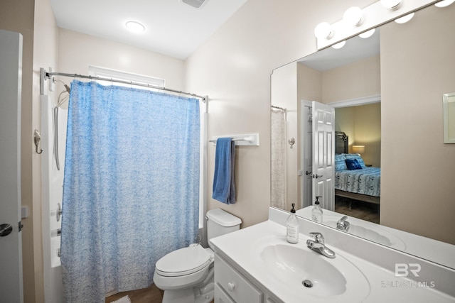 ensuite bathroom featuring vanity, ensuite bath, toilet, and shower / tub combo with curtain